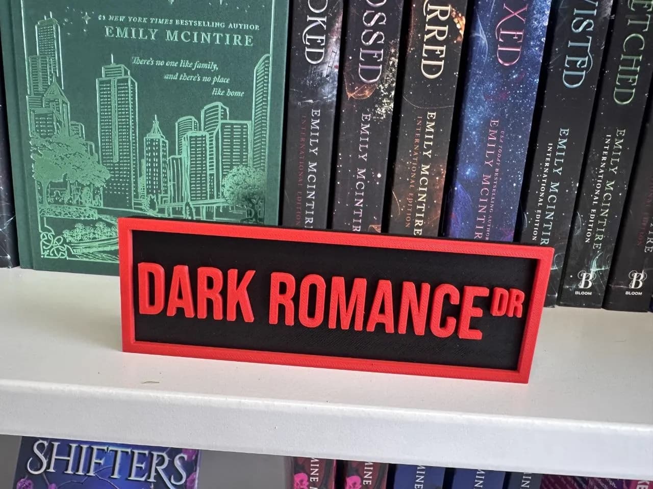 Dark Romance Drive sign with dark romance books