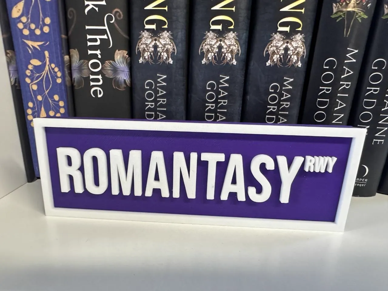 Romantasy Runway sign with fantasy romance books